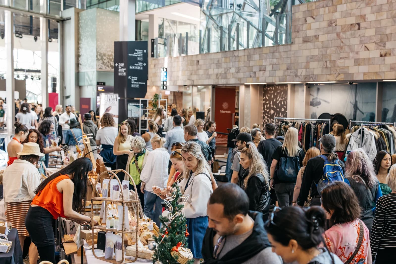Shoppers browsing handmade jewellery and clothing at a previous Boho Luxe Christmas market in Federation Square
