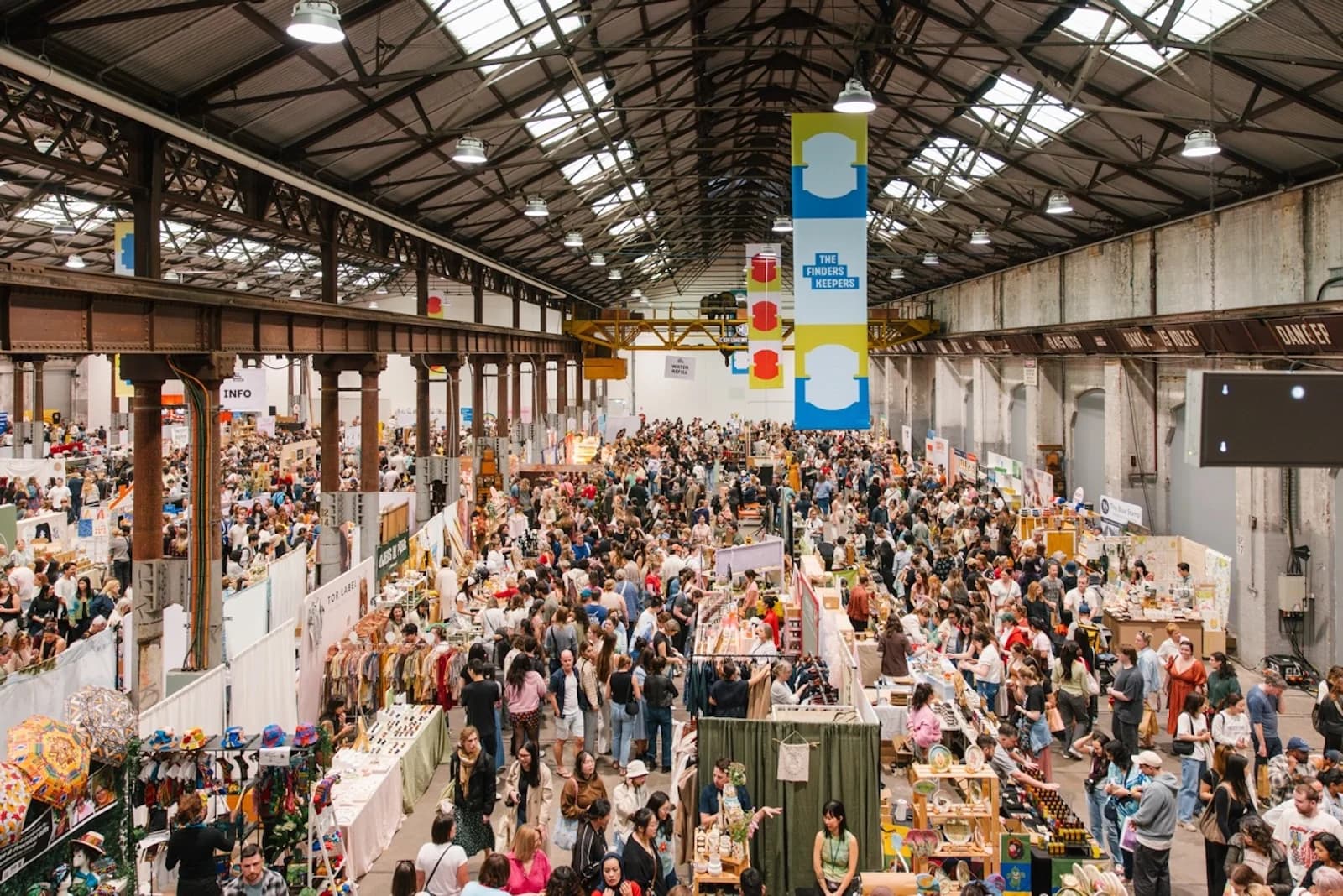 Visitors browsing stalls at a previous Finders Keepers Sydney design market at Carriageworks