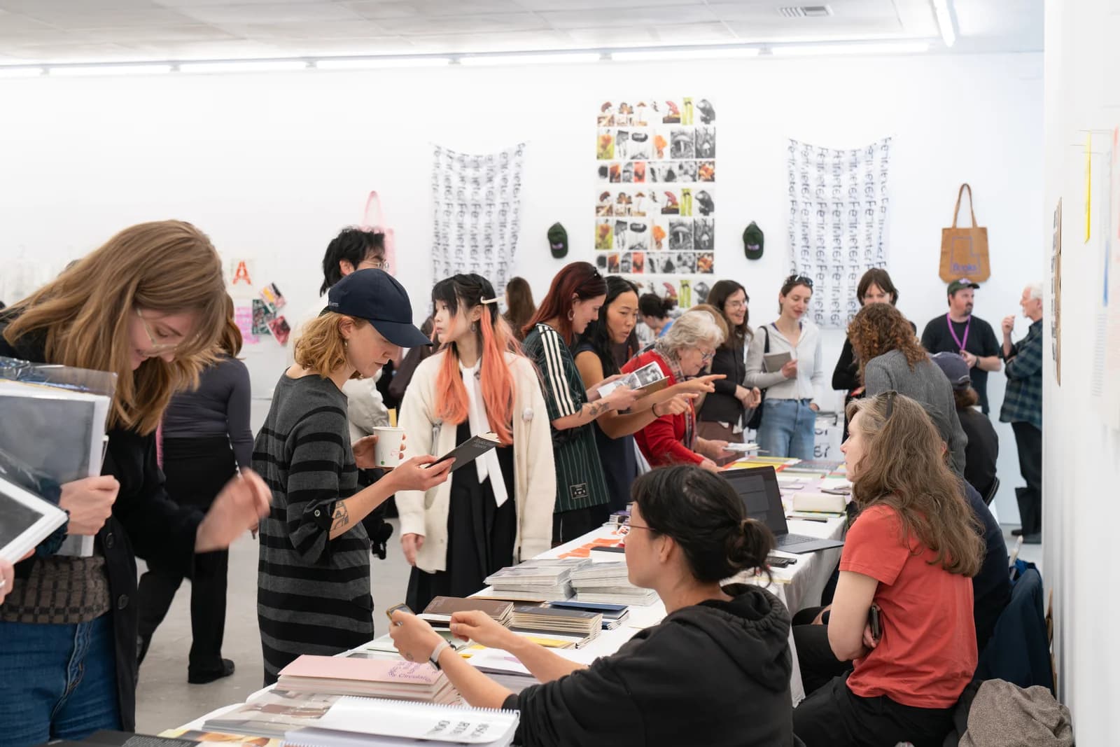Visitors browsing art books at Same Page Art Book Fair